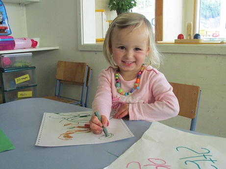 girl colouring book at clevedon kindergarten